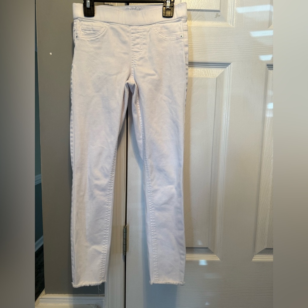 White Justice jeans with elastic waist band; size 12 slim; fringed pants legs